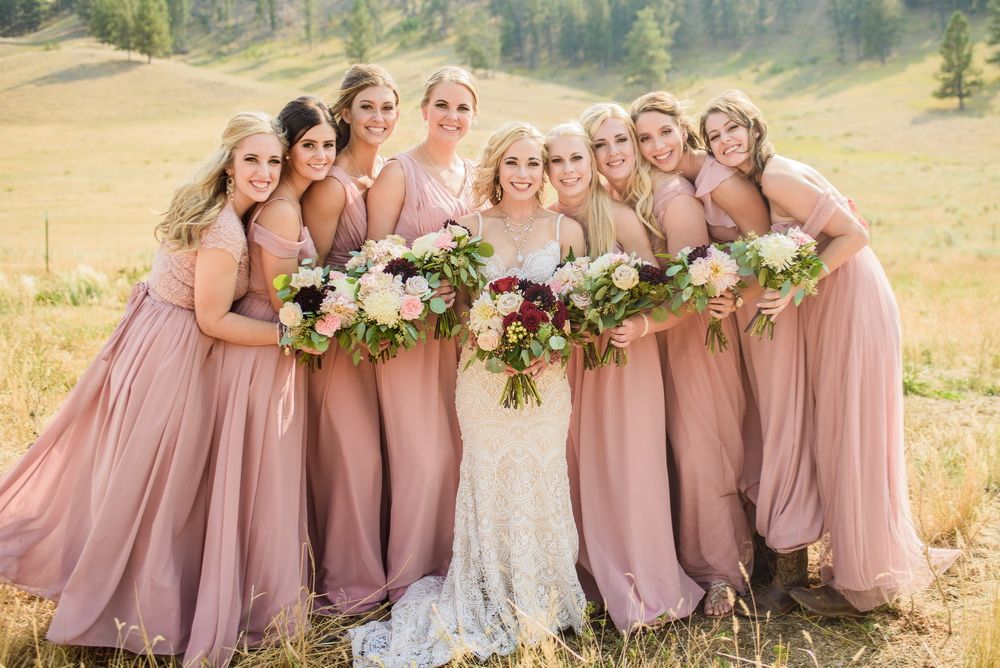 fall weddings bride in elegant long sleeve wedding dress with autumn leaves background